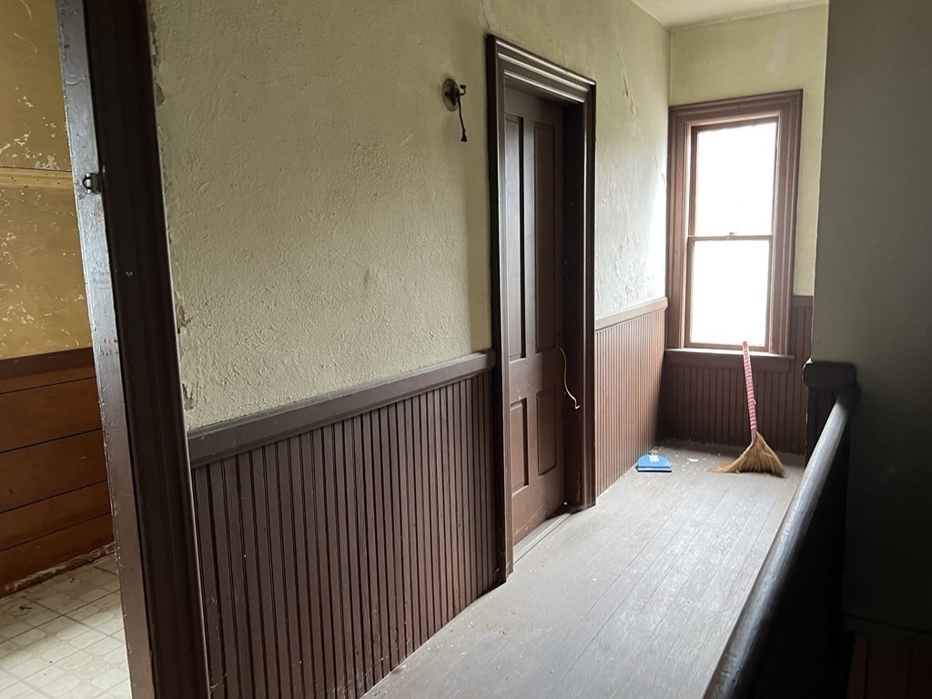 2 Stevens Road Worcester, MA 01603 - Photo 12 of 22 a view of a hallway with furniture and windows