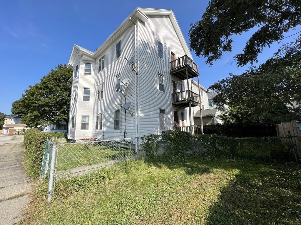 2 Stevens Road Worcester, MA 01603 - Photo 22 of 22 a view of a big house with a yard and plants