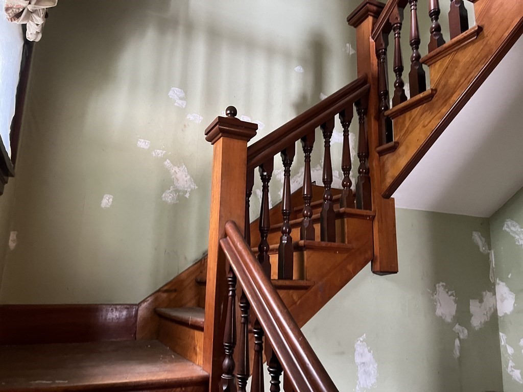 2 Stevens Road Worcester, MA 01603 - Photo 4 of 22 a view of staircase with wooden floor and white walls