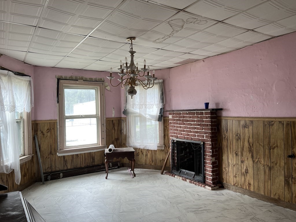 2 Stevens Road Worcester, MA 01603 - Photo 5 of 22 a living room with furniture a window and a fireplace
