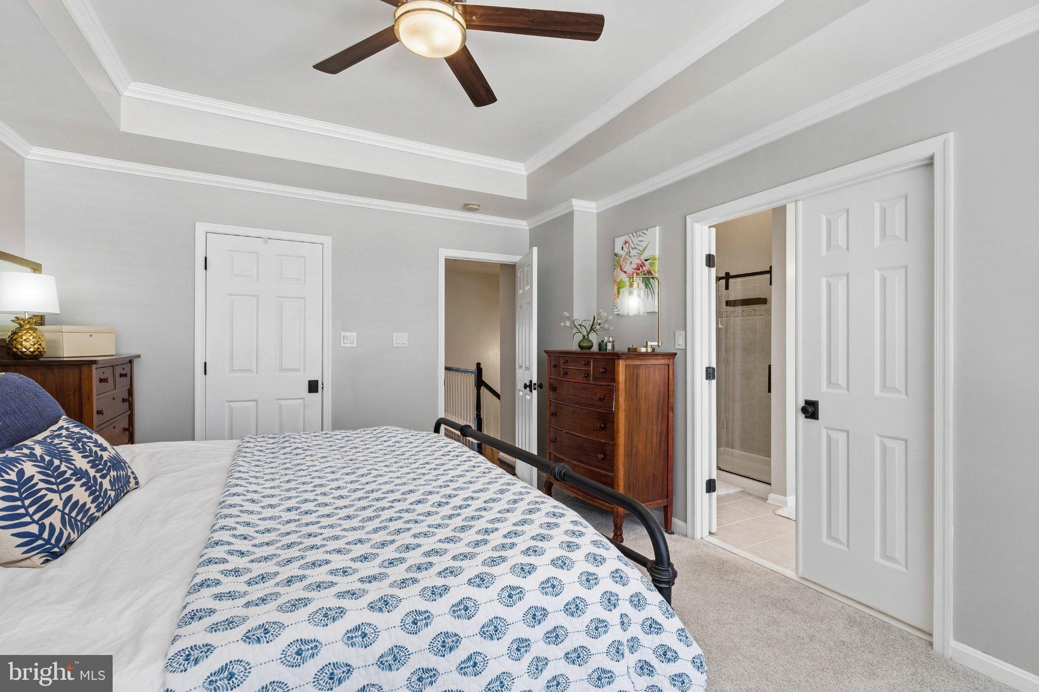2668 Merlin Court Odenton, MD 21113 - Photo 19 of 42 a bedroom with a large bed and a dresser