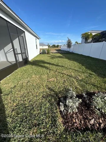 a view of a swimming pool with outdoor seating