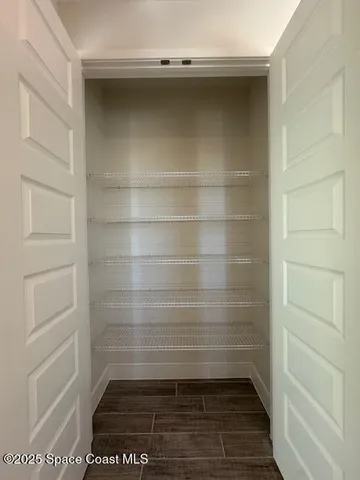 a kitchen with a sink microwave and cabinets