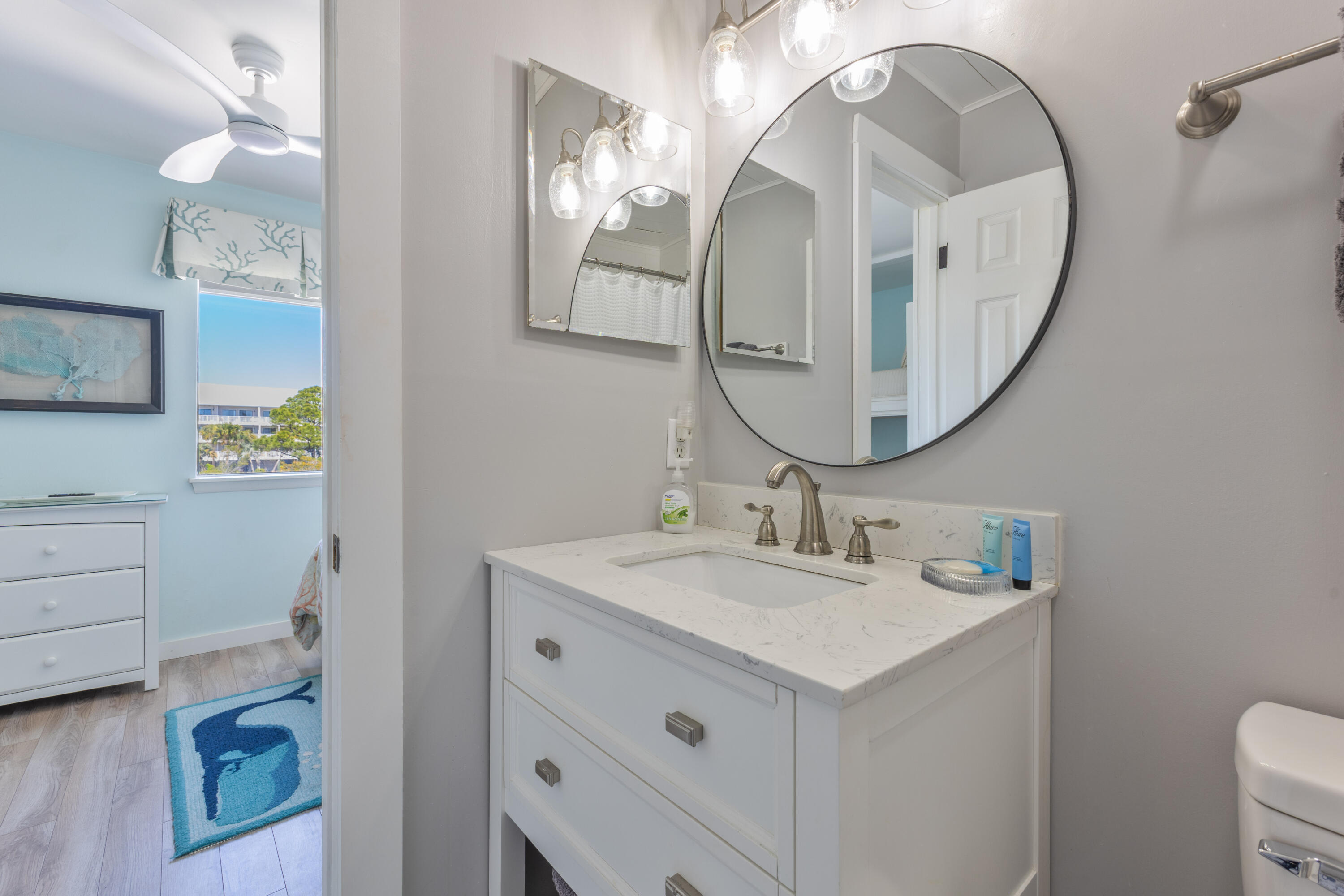 207 Beachfront Trail, Unit 10 Santa Rosa Beach, FL 32459 - Photo 26 of 47 a bathroom with a sink vanity and a mirror