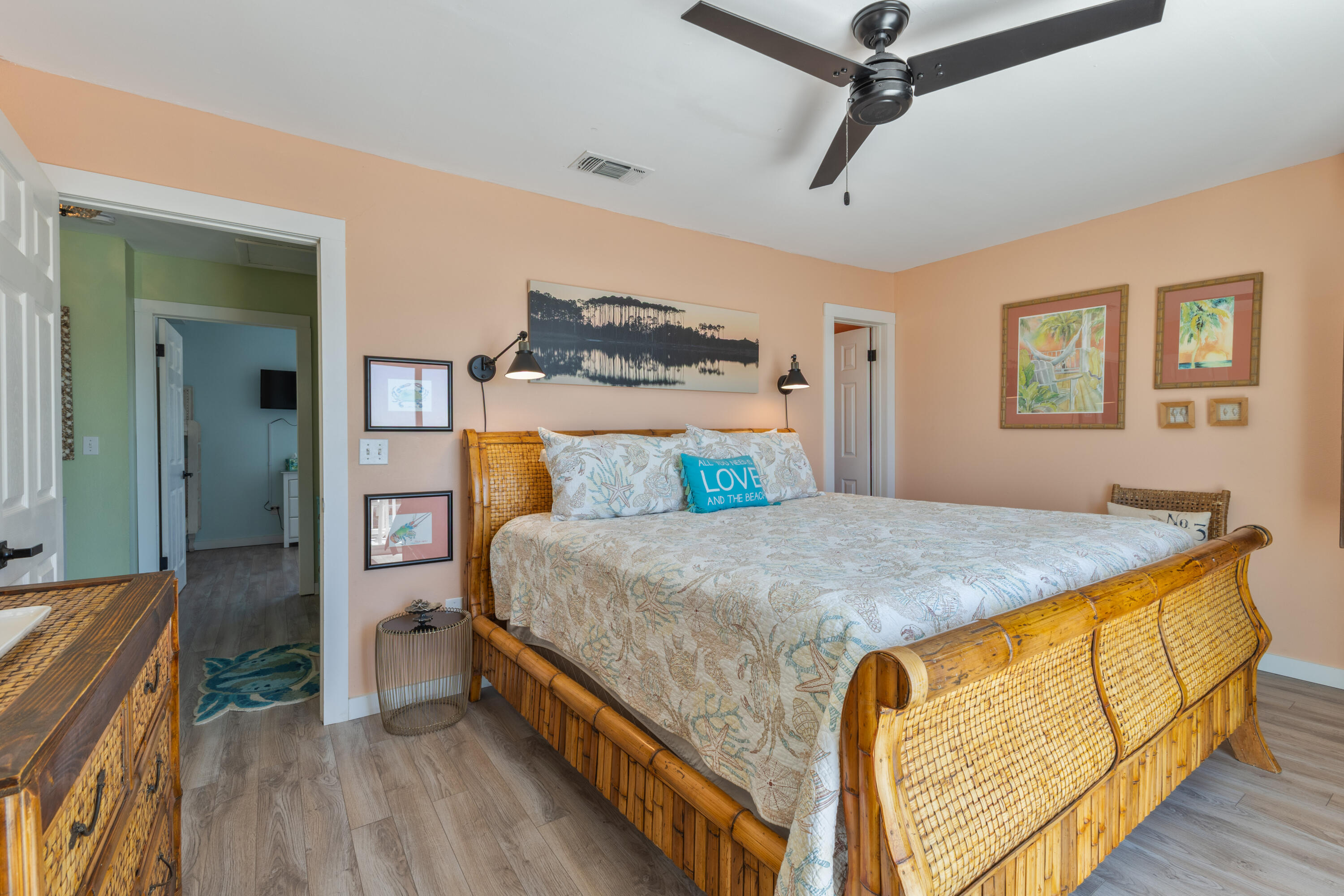 207 Beachfront Trail, Unit 10 Santa Rosa Beach, FL 32459 - Photo 28 of 47 a bedroom with a bed and wooden floor