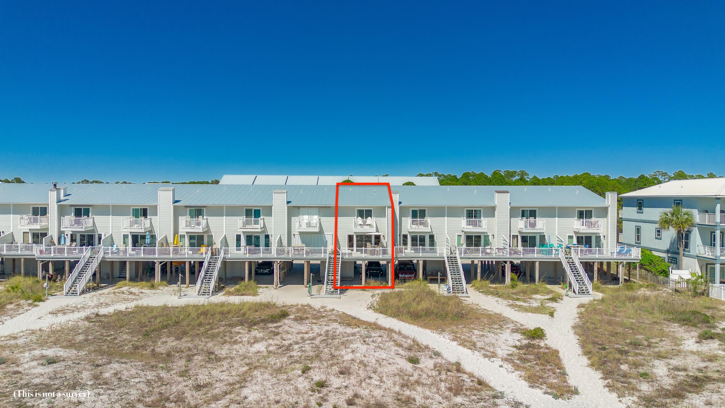 207 Beachfront Trail, Unit 10 Santa Rosa Beach, FL 32459 - Photo 44 of 47 a view of a patio with a table and chairs
