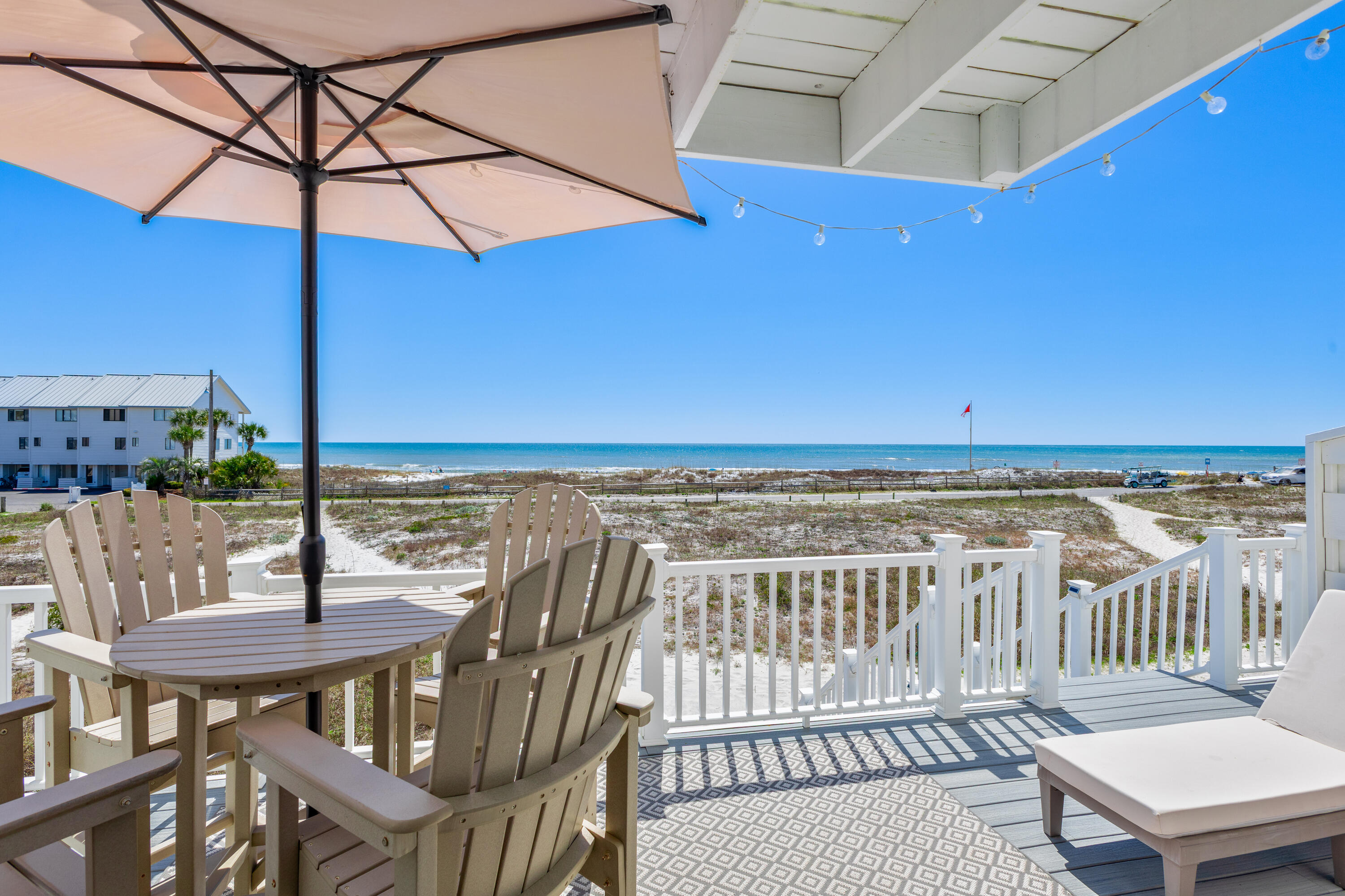 207 Beachfront Trail, Unit 10 Santa Rosa Beach, FL 32459 - Photo 9 of 47 a view of a balcony with table and chairs