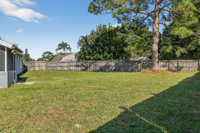 a view of yard with swimming pool