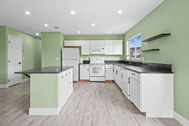 a kitchen with a sink and wooden cabinets