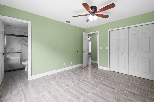 a view of an empty room and a window