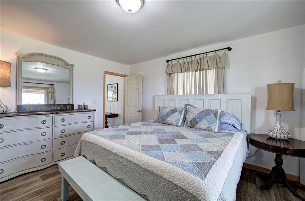 765 Addison Road Buchanan, GA 30113 - Photo 17 of 50 a bedroom with a bed and a dresser in it