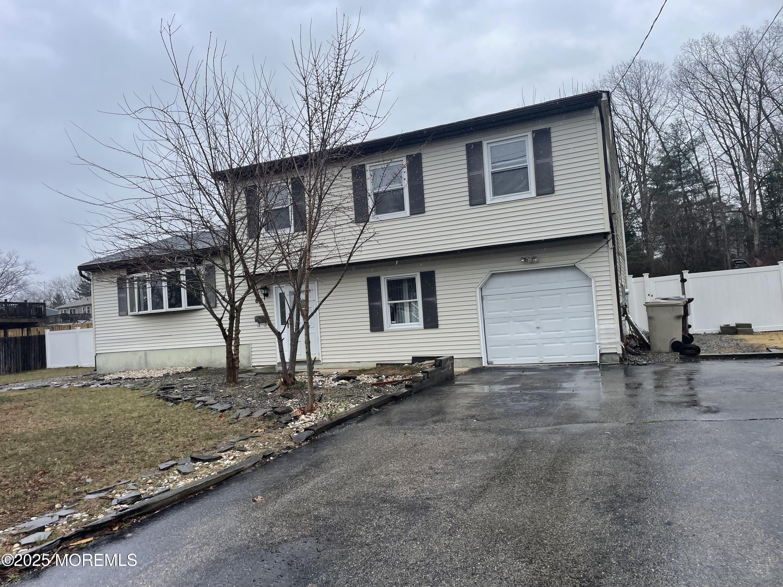 69 Mallard Road Bayville, NJ 08721 - Photo 1 of 21 a front view of a house with a yard