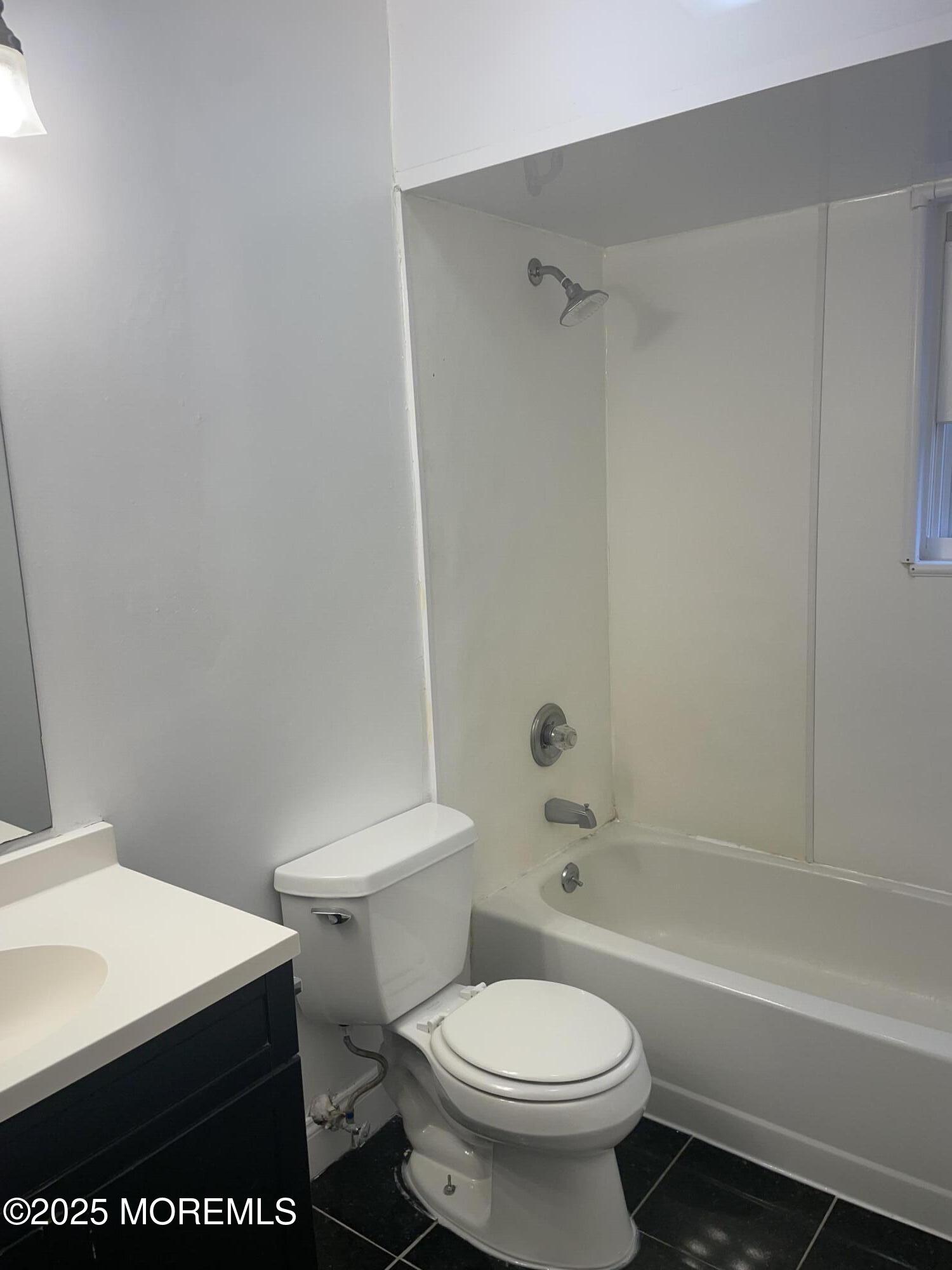 69 Mallard Road Bayville, NJ 08721 - Photo 11 of 21 a white toilet sitting next to a bath tub