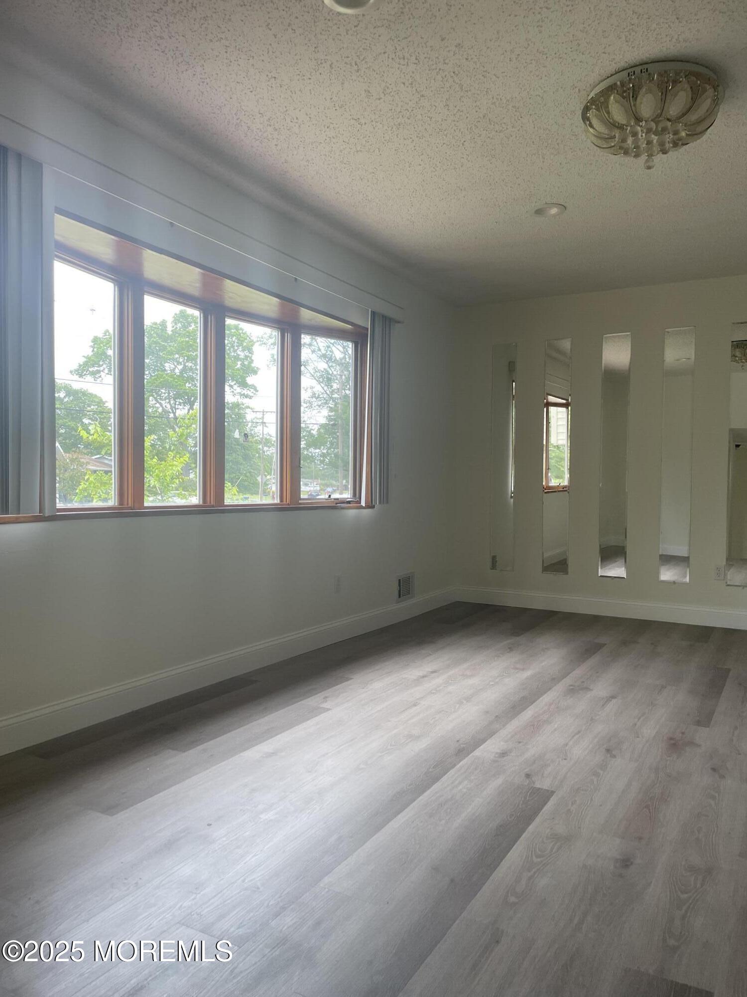 69 Mallard Road Bayville, NJ 08721 - Photo 6 of 21 a view of an empty room with a window