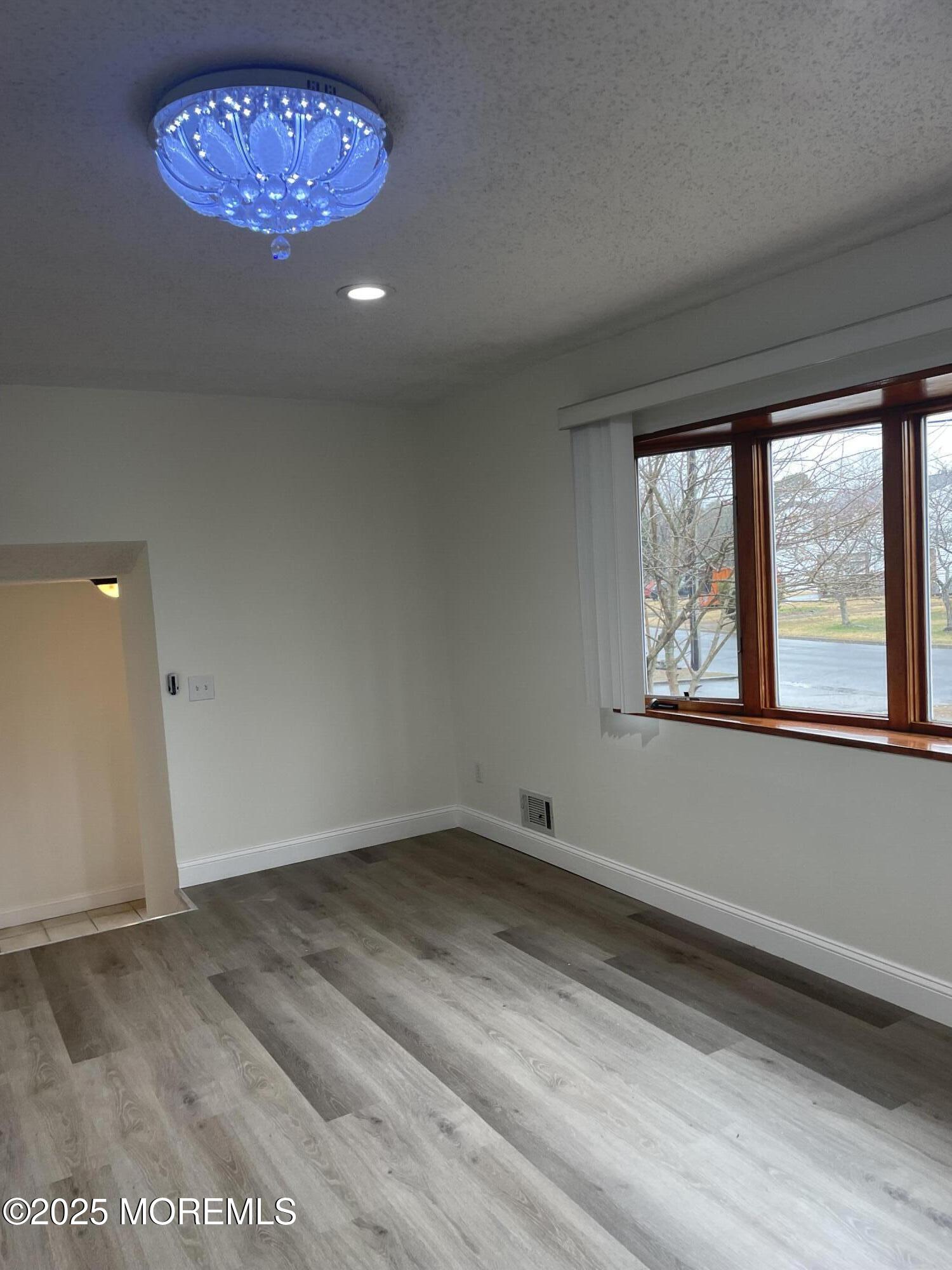 69 Mallard Road Bayville, NJ 08721 - Photo 8 of 21 an empty room with a window
