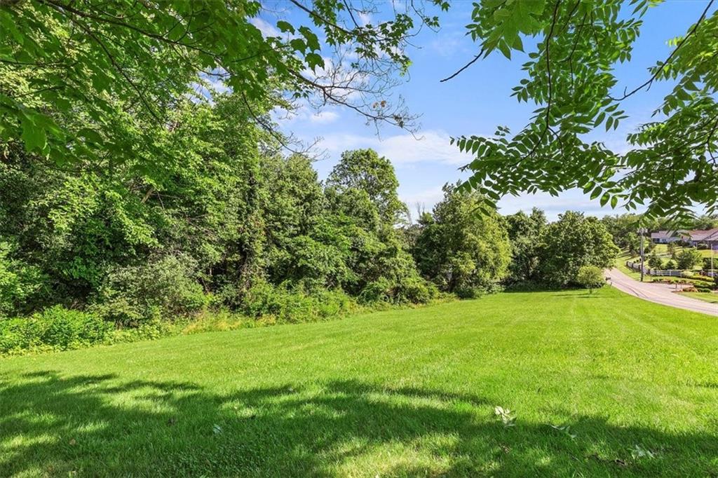 664 Duff Road Sewickley, PA 15143 - Photo 4 of 24 a view of a green field with lots of bushes