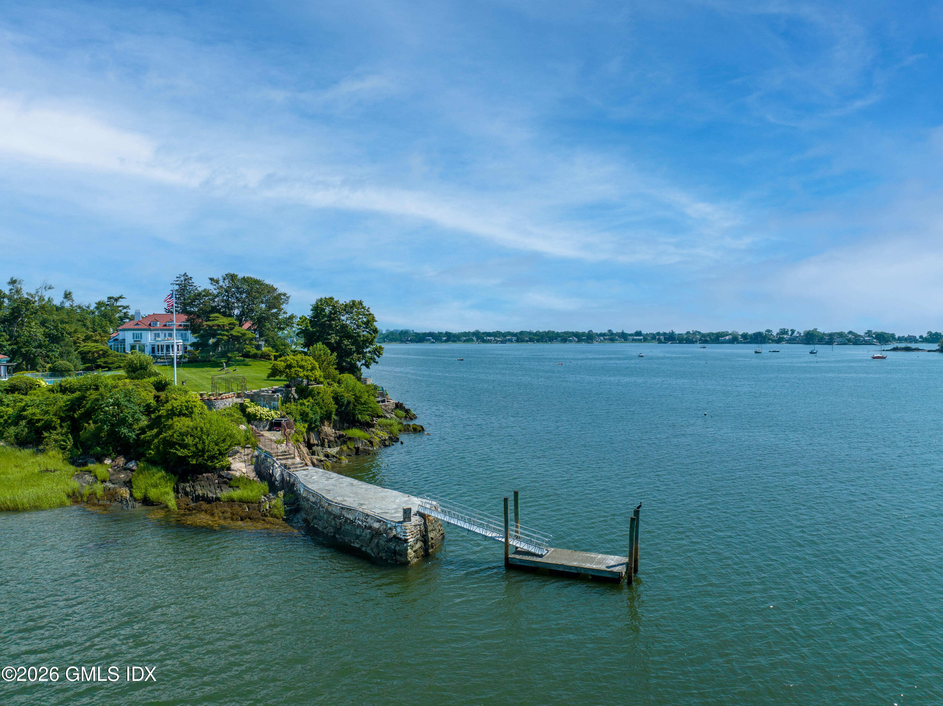 108 Cedar Cliff Road Riverside, CT 06878 - Photo 21 of 49 a view of a lake with houses in the back