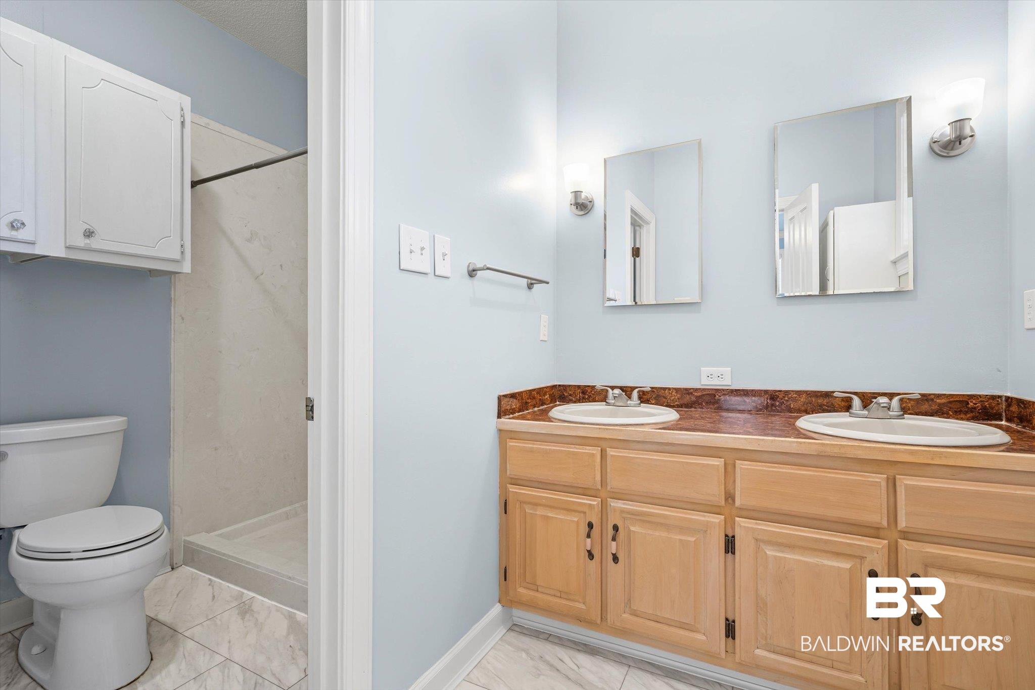 7650 Iron Rush Road Wilmer, AL 36587 - Photo 19 of 34 Bathroom with a shower stall, double vanity, and light marble finish flooring