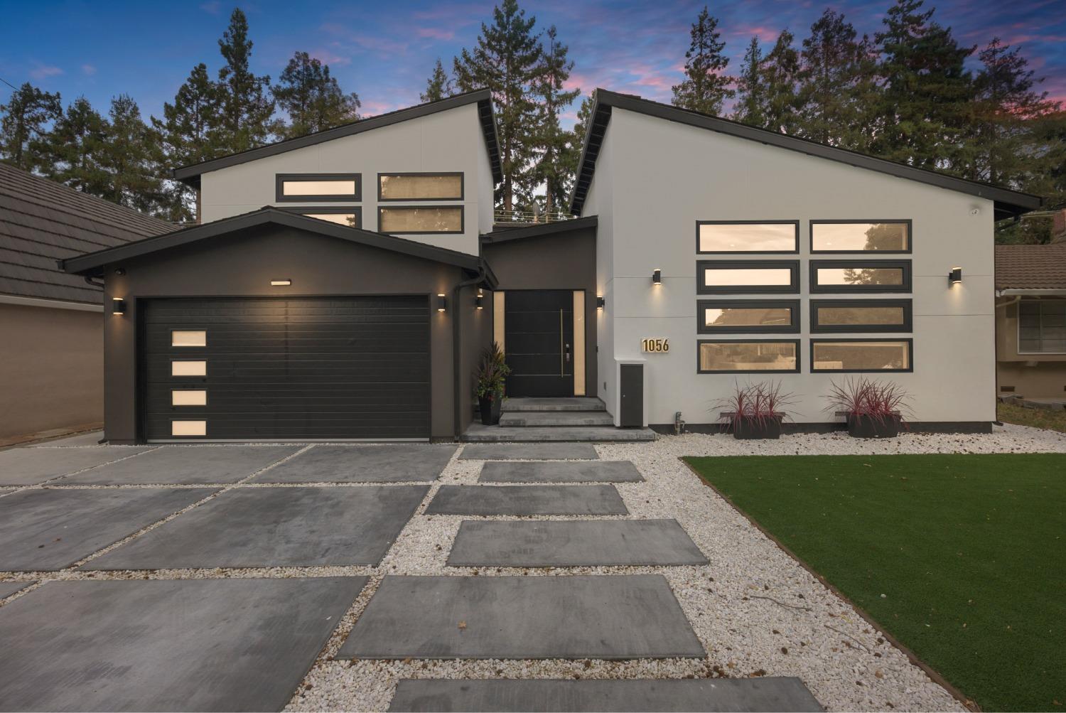 1056 South Daniel Way San Jose, CA 95128 - Photo 1 of 1 a front view of a house with a yard and garage