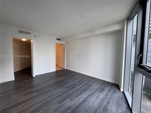 a bathroom with a bathtub a sink a toilet a mirror and shower