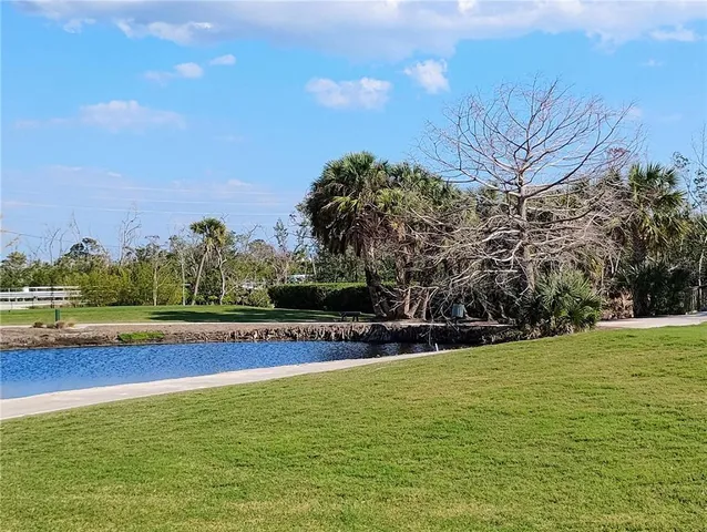 a view of a swimming pool with an outdoor space and seating area