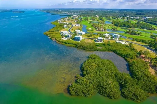 a view of a lake with a yard