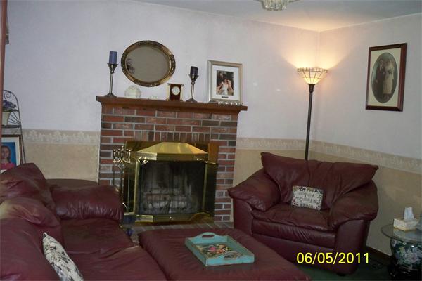 132 Lower Gore Road Webster, MA 01570 - Photo 3 of 16 a living room with furniture and a fireplace