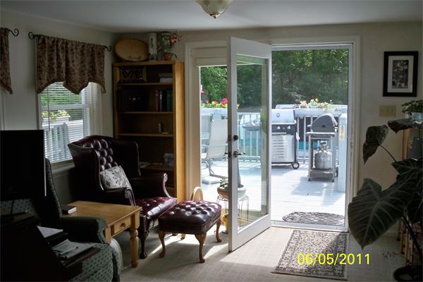 132 Lower Gore Road Webster, MA 01570 - Photo 4 of 16 a picture of a living room with furniture and a floor to ceiling window