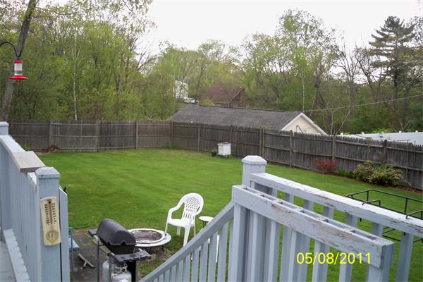 132 Lower Gore Road Webster, MA 01570 - Photo 8 of 16 a view of a chair and table in the backyard