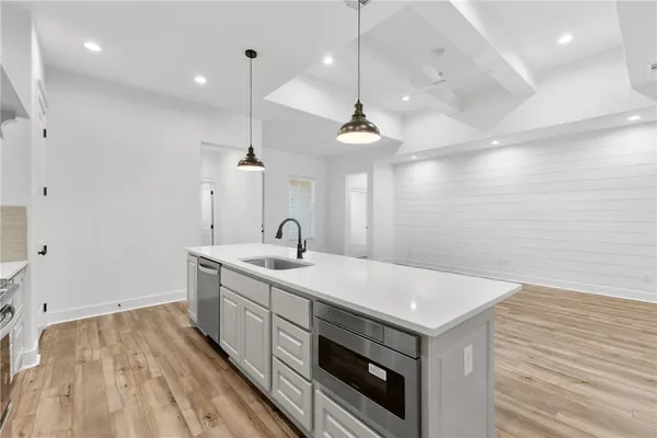 a kitchen with a sink and stove