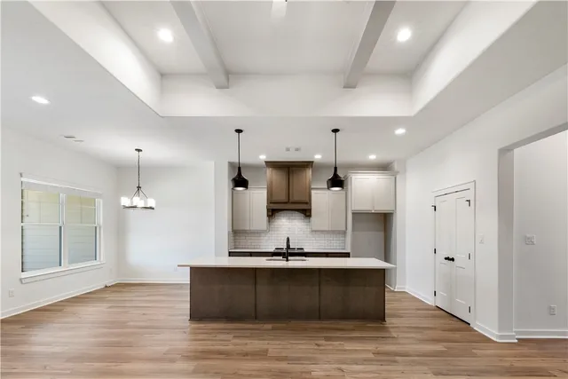 a view of kitchen with wooden floor and window