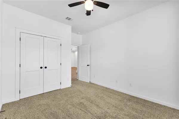 a bathroom with a sink a mirror and a toilet