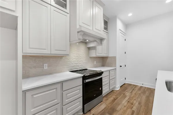 a kitchen with a sink and cabinets
