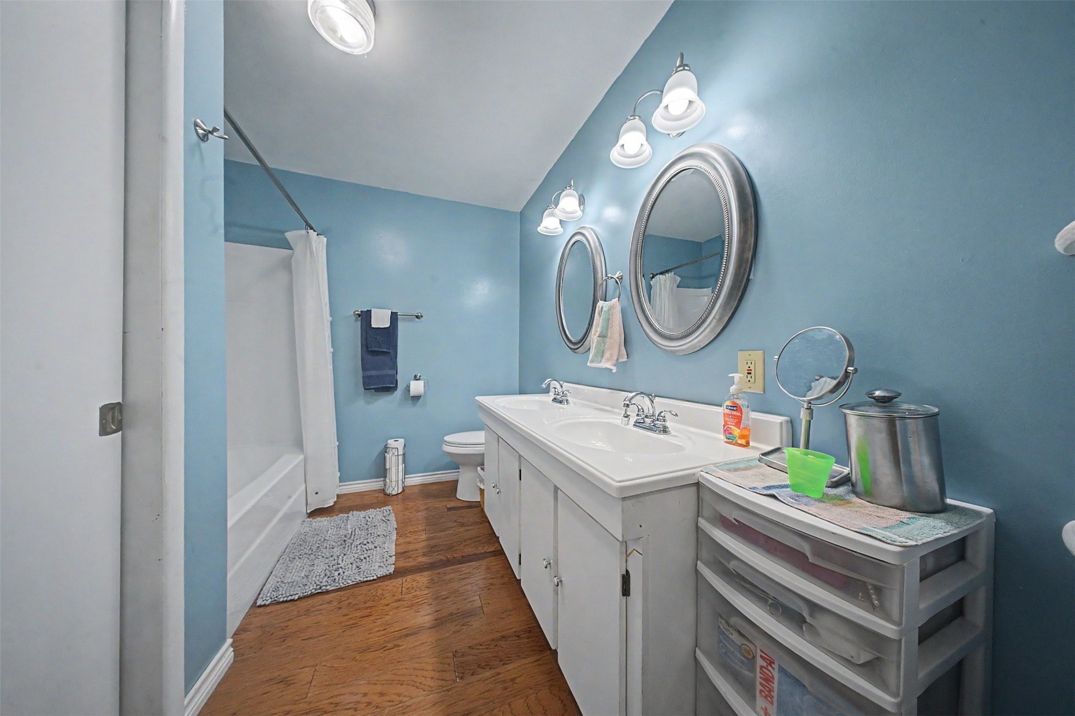 1442 East Johnson Drive Rusk, TX 75785 - Photo 18 of 34 Marvelous bath featuring a tub/shower combo and lovely laminate floors.