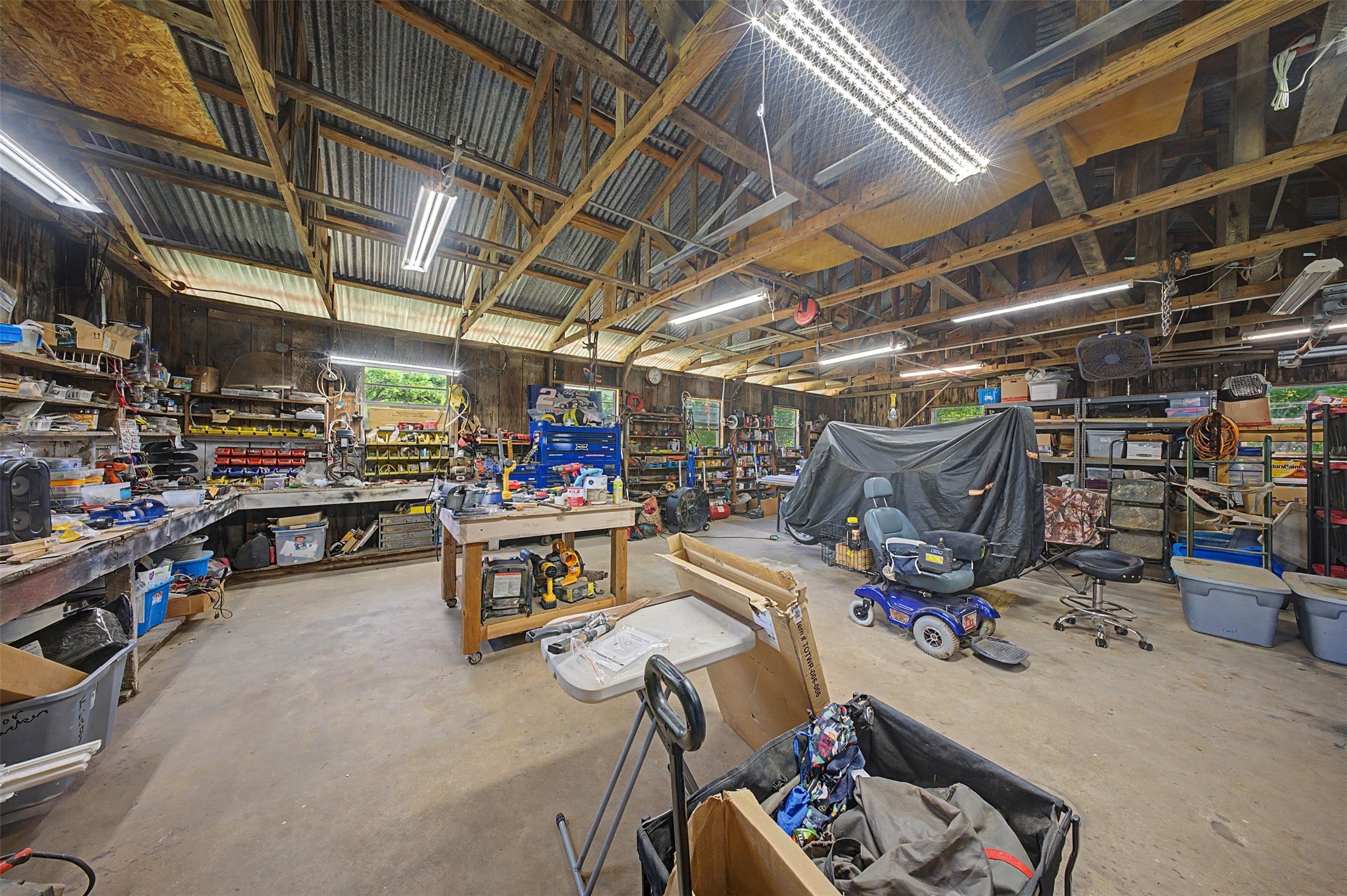 1442 East Johnson Drive Rusk, TX 75785 - Photo 24 of 34 This awesome workshop/garage offers tons of space and shelving.