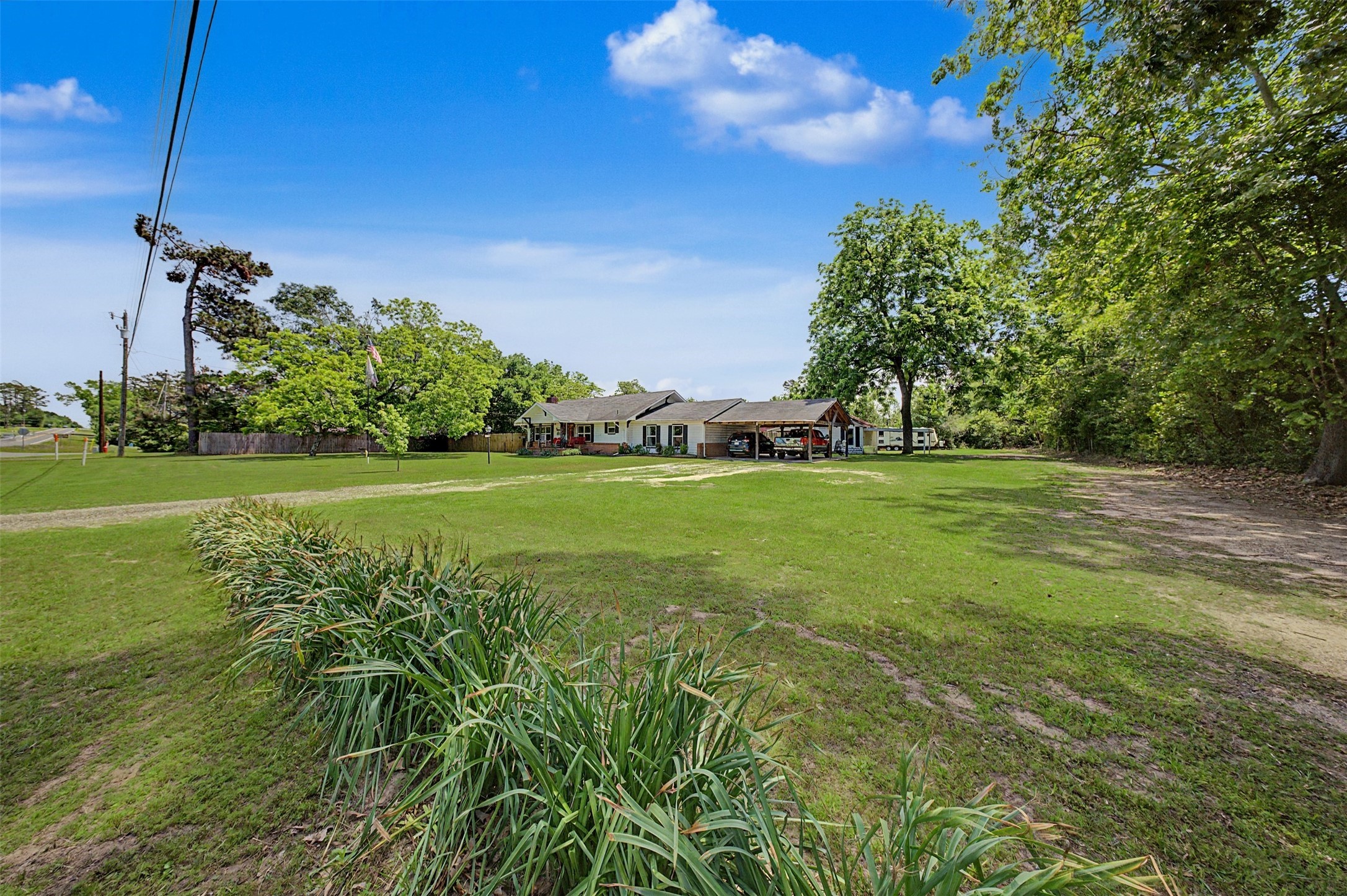1442 East Johnson Drive Rusk, TX 75785 - Photo 3 of 34 Take a look at this amazing lot! Tons of space and immaculate landscaping.