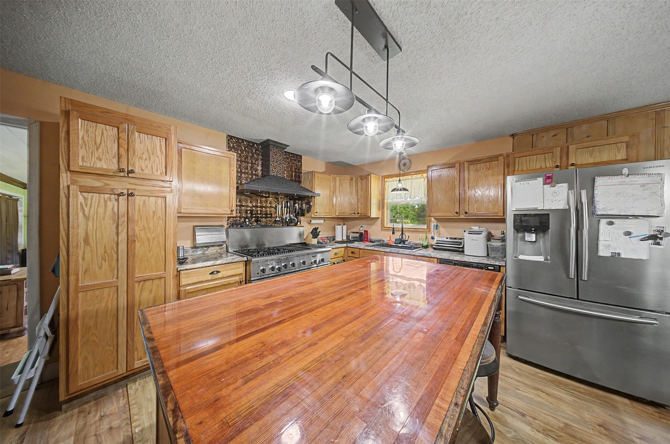 1442 East Johnson Drive Rusk, TX 75785 - Photo 7 of 34 Elegant island kitchen featuring stainless appliances and tons of cabinet and counter space.