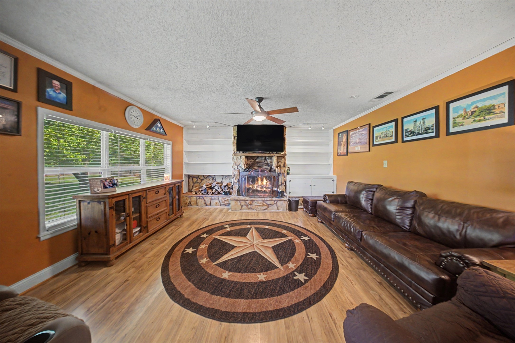1442 East Johnson Drive Rusk, TX 75785 - Photo 10 of 34 This elegant living space features stunning laminate floors, a stone fireplace, and gorgeous built ins!