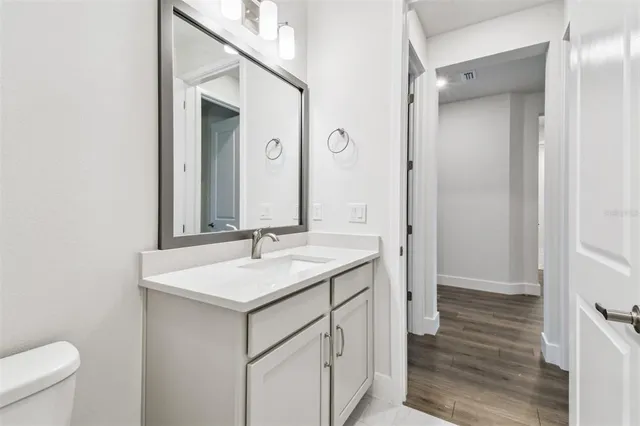 a bathroom with a sink and vanity