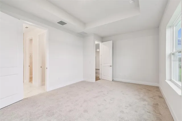 a bathroom with a granite countertop sink double and mirror