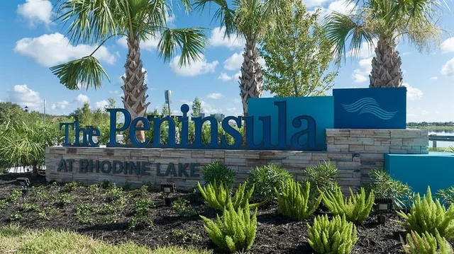 an aerial view of a house with a lake view