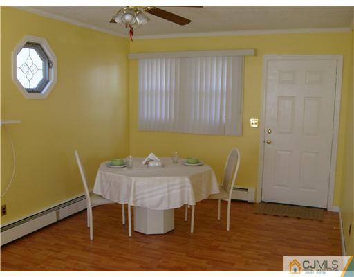 61 Winthrop Road Edison, NJ 08817 - Photo 4 of 6 a view of a dining room with furniture and wooden floor
