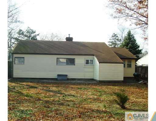 61 Winthrop Road Edison, NJ 08817 - Photo 6 of 6 a front view of a house with a yard