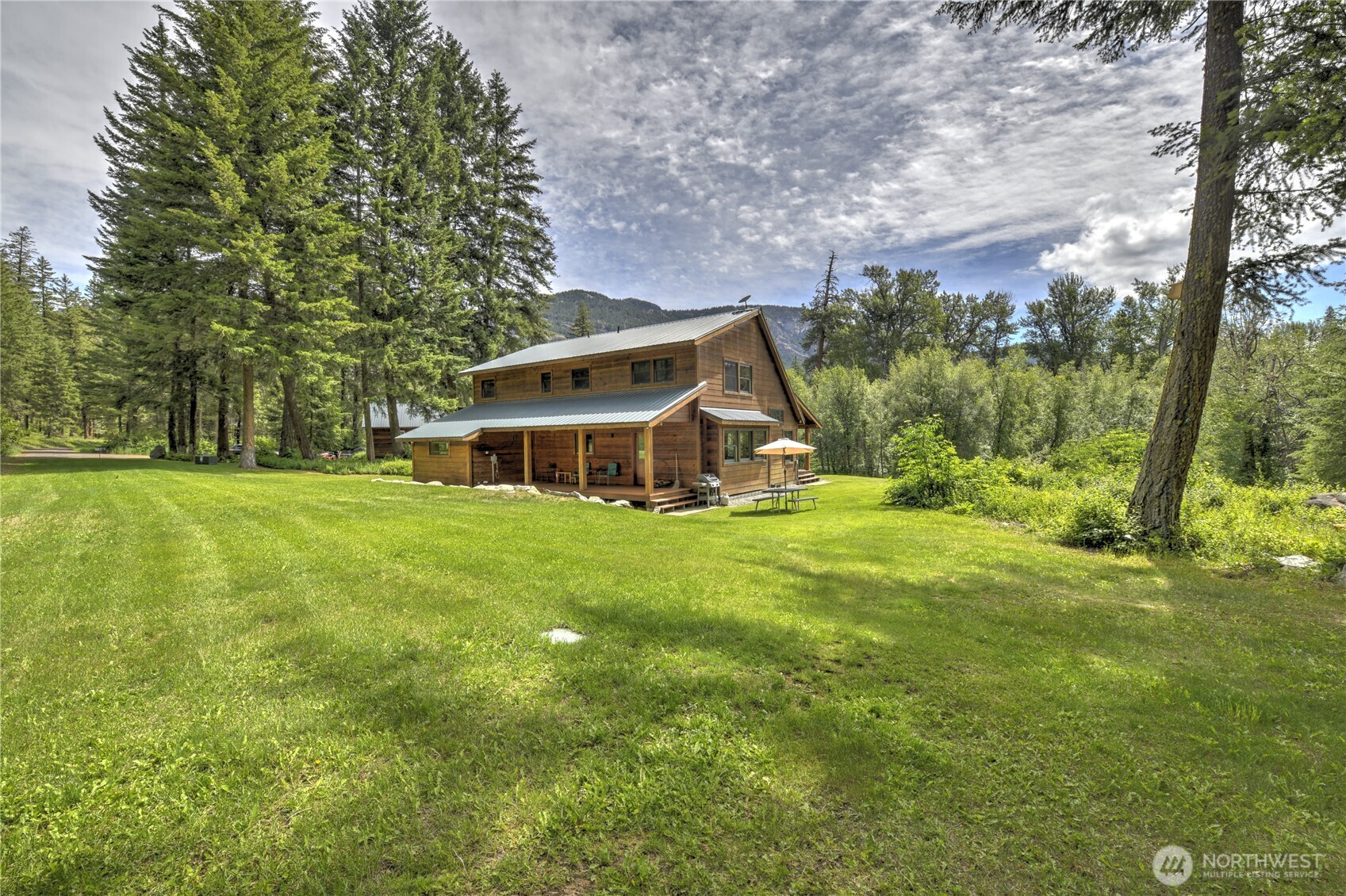 19 2 Rivers Road Mazama, WA 98833 - Photo 13 of 40 a view of a house with a big yard