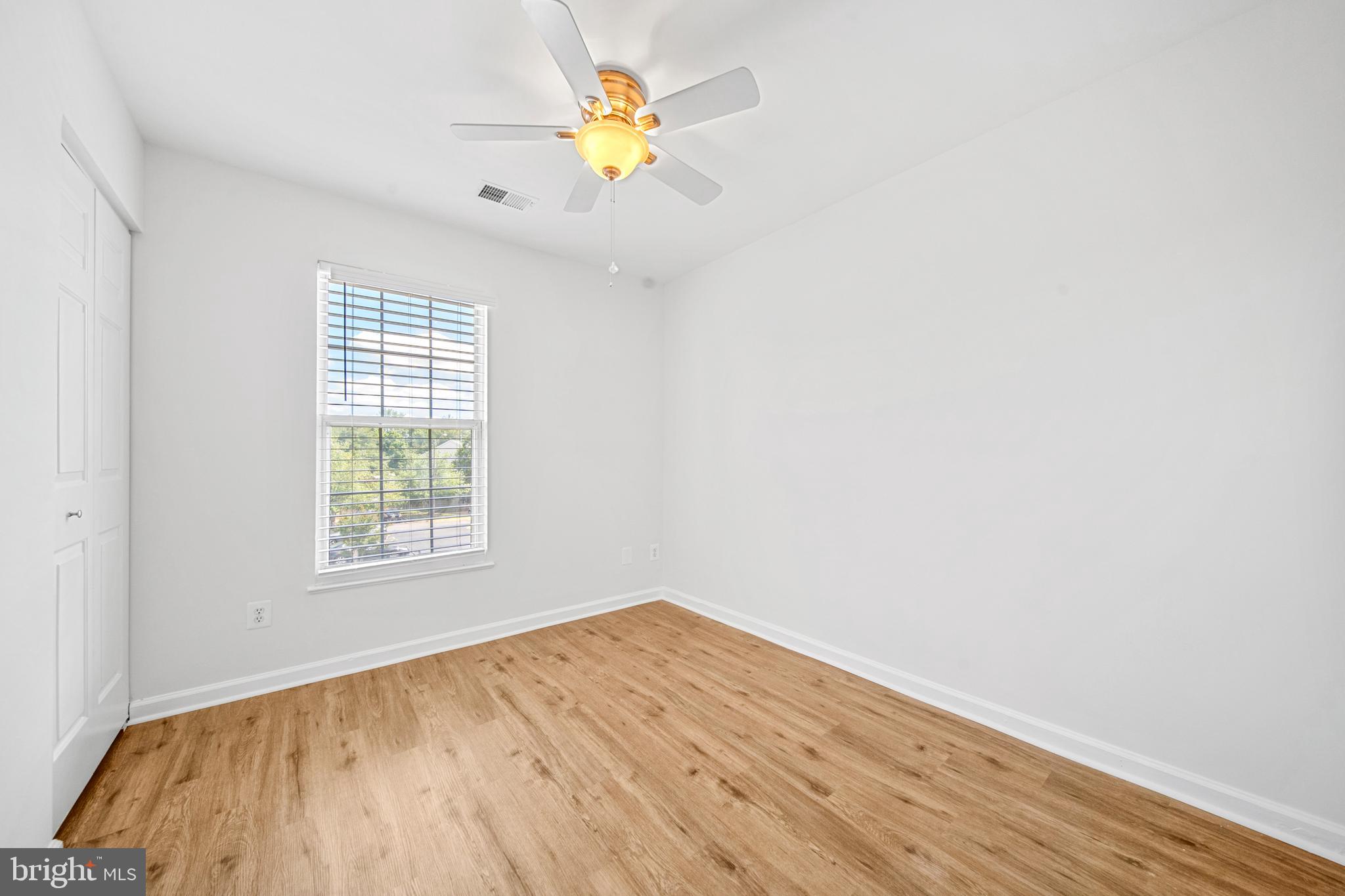 8596 Cold Harbor Loop Manassas, VA 20111 - Photo 28 of 52 an empty room with a window and wooden floor