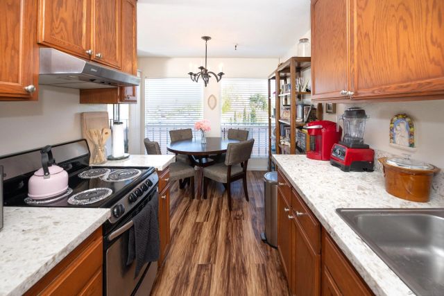 a kitchen with granite countertop lots of counter top space
