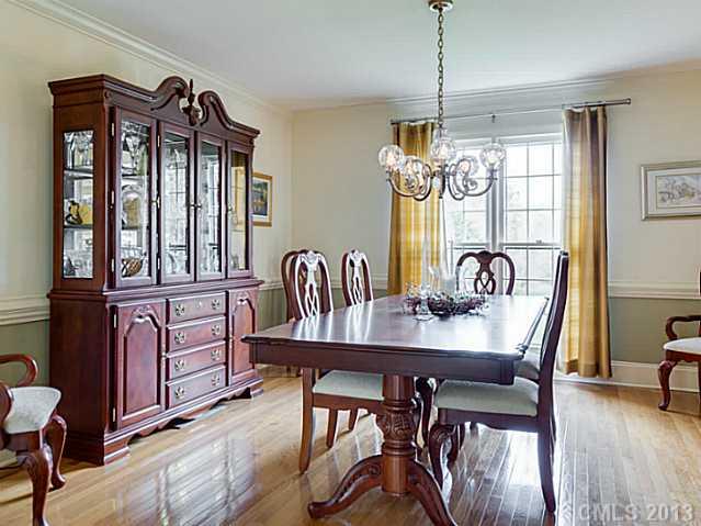 7227 Alexander Road Charlotte, NC 28270 - Photo 3 of 16 a view of a a dining room with furniture window and wooden floor