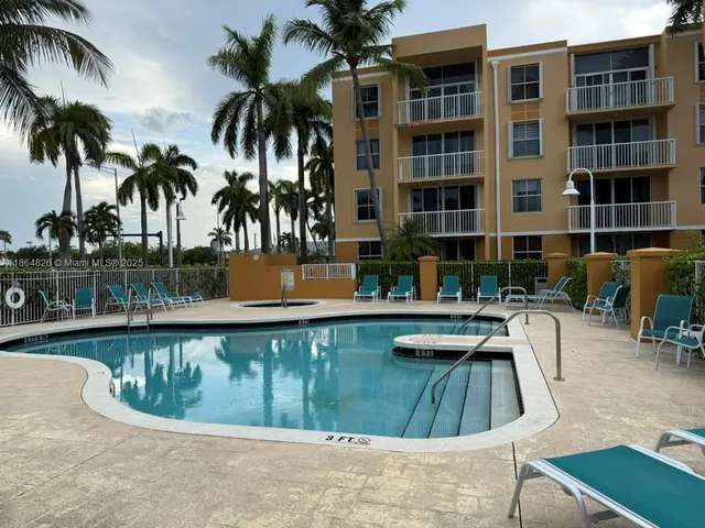 a view of a swimming pool with a lounge chair