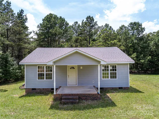 an empty room with a empty space and windows