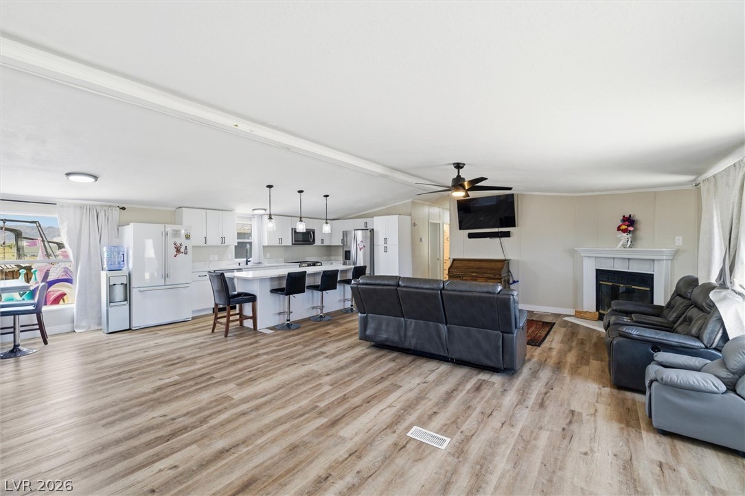 4331 Retread Road Pahrump, NV 89048 - Photo 29 of 31 An open floorplan seamlessly connects the kitchen and living areas, offering effortless entertaining.
